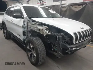 2015 Jeep Cherokee Trailhawk with VIN 1C4PJMBS1FW665500, listed as a IAAI auction lot 42068268 with 127,246 mi miles. Bid and sale history available at carsss.com. Image 1.