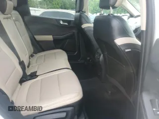 2020 Ford Escape Titanium z VIN 1FMCU9J9XLUB57675, wystawiony jako Copart lot #57777795 z przebiegiem Nie podano mil oraz Szkoda całkowita • Salvage title. Historia ofert i sprzedaży dostępna na DreamBid. Obrazek 11.