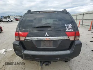 2010 Mitsubishi Endeavor LS with VIN 4A4JM2AS0AE011338, listed as a Copart auction lot 83211414 with 104,582 mi miles and Salvage Title. Bid and sale history available at carsss.com. Image 6.