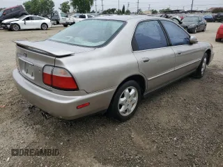1996 Honda Accord EX с VIN 1HGCE6671TA003110, выставлен на аукционе Copart как лот 60751665 с пробегом 129 984 миль миль и Чистый • Clean title. История ставок и продаж доступна на DreamBid. Изображение 3.