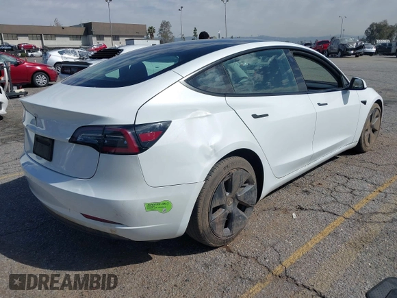 2023 Tesla Model 3 with VIN 5YJ3E1EA8PF398110, listed as a IAAI auction lot 41692006 with 112,699 mi miles and . Bid and sale history available at carsss.com. Image 4.