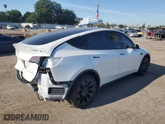 2022 Tesla Model Y Long Range with VIN 7SAYGDEE1NF339663, listed as a Copart auction lot 49771965 with 33,734 mi miles and Salvage Title. Bid and sale history available at carsss.com. Image 3.