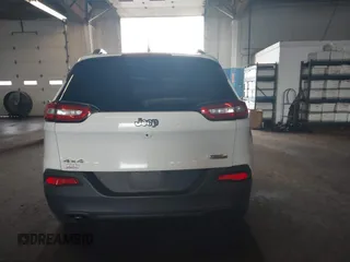 2015 Jeep Cherokee Latitude with VIN 1C4PJMCBXFW784869, listed as a IAAI auction lot 41951297 with 138,396 mi miles. Bid and sale history available at carsss.com. Image 16.
