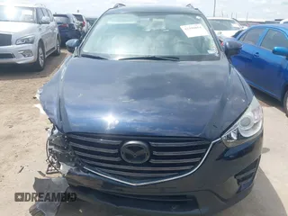 2016 Mazda CX-5 Sport z VIN JM3KE2BY0G0633611, wystawiony jako IAAI lot #42390654 z przebiegiem Nie podano mil oraz . Historia ofert i sprzedaży dostępna na DreamBid. Obrazek 13.