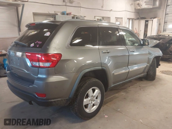 2012 Jeep Grand Cherokee Laredo with VIN 1C4RJFAG3CC209142, listed as a IAAI auction lot 41978296 with 201,796 mi miles. Bid and sale history available at carsss.com. Image 4.
