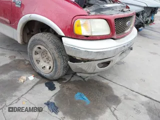 2003 Ford F-150 XL with VIN 2FTPX18LX3CA89961, listed as a IAAI auction lot 41901357 with 199,708 mi miles. Bid and sale history available at carsss.com. Image 12.