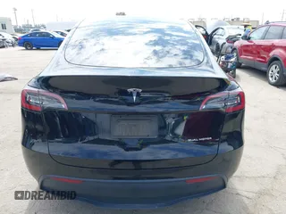 2023 Tesla Model Y Long Range z VIN 7SAYGDEE2PF863200, wystawiony jako IAAI lot #41805168 z przebiegiem 25 480 mil mil oraz . Historia ofert i sprzedaży dostępna na DreamBid. Obrazek 17.