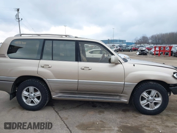 1999 Lexus LX 470 z VIN JT6HT00W8X0045705, wystawiony jako IAAI lot #42005587 z przebiegiem 443 758 mil mil oraz . Historia ofert i sprzedaży dostępna na DreamBid. Obrazek 13.