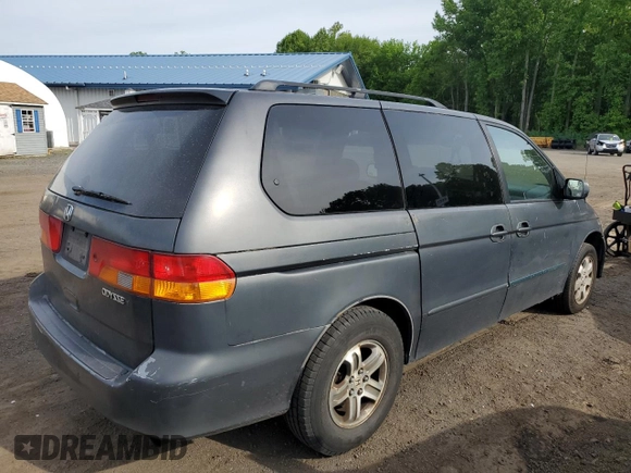 2004 Honda Odyssey EX-RES z VIN 5FNRL188X4B115002, wystawiony jako Copart lot #57883945 z przebiegiem Nie podano mil oraz Szkoda całkowita • Salvage title. Historia ofert i sprzedaży dostępna na DreamBid. Obrazek 3.