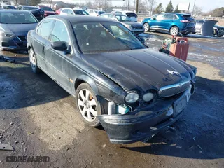 2004 Jaguar X-Type with VIN SAJEA51C74WE14084, listed as a IAAI auction lot 41560766 with 166,419 mi miles. Bid and sale history available at carsss.com. Image 1.