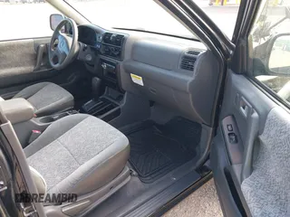2001 Isuzu Rodeo S z VIN 4S2CK58W914361058, wystawiony jako IAAI lot #42404904 z przebiegiem 125 945 mil mil oraz . Historia ofert i sprzedaży dostępna na DreamBid. Obrazek 5.