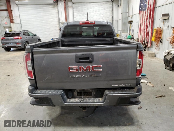2021 GMC Canyon 4WD Denali with VIN 1GTG6EEN3M1129459, listed as a Copart auction lot 87618305 with 37,663 mi miles and Salvage Title. Bid and sale history available at carsss.com. Image 6.