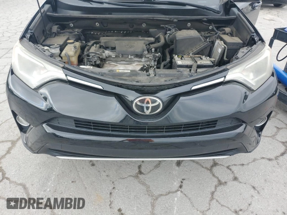 2018 Toyota RAV4 XLE with VIN 2T3WFREV4JW429334, listed as a Copart auction lot 56934855 with 117,761 mi miles and Salvage title. Bid and sale history available at DreamBid. Image 11.
