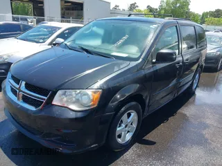 2012 Dodge Grand Caravan SXT with VIN 2C4RDGCG8CR247824, listed as a IAAI auction lot 42210397 with 200,919 mi miles and . Bid and sale history available at DreamBid. Image 2.