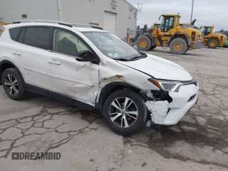 2018 Toyota RAV4 XLE with VIN JTMRFREV6JJ734927, listed as a IAAI auction lot 41510616 with 119,687 mi miles. Bid and sale history available at carsss.com. Image 1.