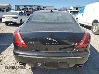 2013 Jaguar XJ Portfolio with VIN SAJWJ2GDXD8V45921, listed as a Copart auction lot 49289825 with 115,152 mi miles and Salvage title. Bid and sale history available at DreamBid. Image 6.