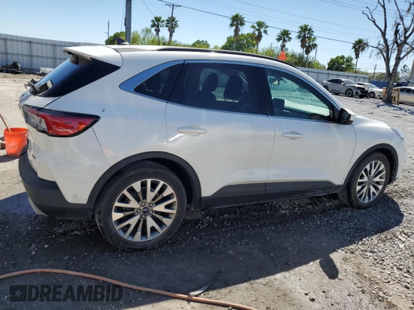 2021 Ford Escape Titanium Hybrid z VIN 1FMCU0DZ5MUB04522, wystawiony jako Copart lot #49127385 z przebiegiem 66 996 mil mil oraz Szkody całkowita. Historia ofert i sprzedaży dostępna na DreamBid. Obrazek 3.