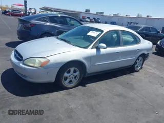 2003 Ford Taurus SE Standard with VIN 1FAFP53UX3G268265, listed as a IAAI auction lot 42090151 with 139,734 mi miles. Bid and sale history available at carsss.com. Image 13.