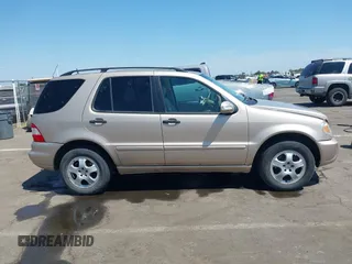 2004 Mercedes-Benz M 350 with VIN 4JGAB57E14A512245, listed as a IAAI auction lot 42452747 with 198,021 mi miles and . Bid and sale history available at DreamBid. Image 14.
