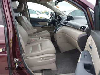 2014 Honda Odyssey Touring with VIN 5FNRL5H9XEB073156, listed as a IAAI auction lot 41990714 with 166,129 mi miles and . Bid and sale history available at DreamBid. Image 5.