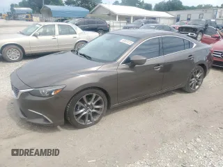 2017 Mazda 6 Grand Touring с VIN JM1GL1W59H1113529, выставлен на аукционе Copart как лот 60661015 с пробегом 99 887 миль миль и Списание • Salvage title. История ставок и продаж доступна на DreamBid. Изображение 1.