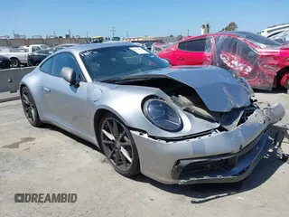 2023 Porsche 911 Carrera with VIN WP0AA2A93PS206048, listed as a IAAI auction lot 42022225 with 6,439 mi miles and . Bid and sale history available at DreamBid. Image 1.