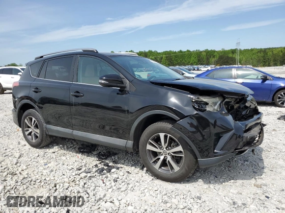 2018 Toyota RAV4 XLE with VIN 2T3WFREV2JW458816, listed as a Copart auction lot 53235105 with 135,469 mi miles and Salvage Title. Bid and sale history available at DreamBid. Image 4.