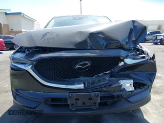 2018 Mazda CX-5 Grand Touring z VIN JM3KFADM7J0327272, wystawiony jako IAAI lot #42279536 z przebiegiem 97 478 mil mil oraz . Historia ofert i sprzedaży dostępna na DreamBid. Obrazek 12.
