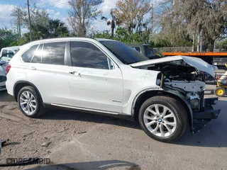 2016 BMW X5 xDrive35i with VIN 5UXKR0C54G0P27141, listed as a IAAI auction lot 41553602 with 61,947 mi miles. Bid and sale history available at carsss.com. Image 14.