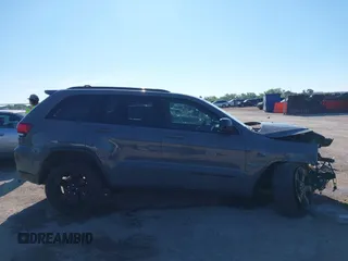 2019 Jeep Grand Cherokee Laredo E with VIN 1C4RJFAG2KC611457, listed as a IAAI auction lot 42212982 with 97,603 mi miles and . Bid and sale history available at DreamBid. Image 13.
