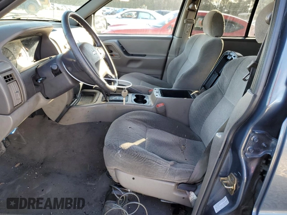 2001 Jeep Grand Cherokee Laredo z VIN 1J4GW48S91C578800, wystawiony jako Copart lot #87934695 z przebiegiem 250 784 mil mil oraz Szkoda całkowita • Salvage title. Historia ofert i sprzedaży dostępna na DreamBid. Obrazek 7.
