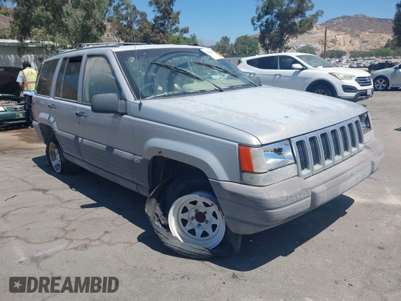 1997 Jeep Grand Cherokee Laredo z VIN 1J4GZ58S4VC720943, wystawiony jako IAAI lot #42648807 z przebiegiem 231 203 mil mil oraz . Historia ofert i sprzedaży dostępna na DreamBid. Obrazek 1.