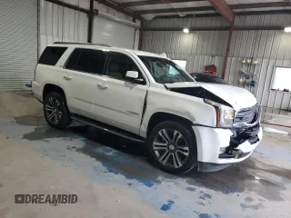 2016 GMC Yukon SLT with VIN 1GKS1BKC5GR450147, listed as a Copart auction lot 51058805 with 163,944 mi miles and Salvage Title. Bid and sale history available at carsss.com. Image 4.