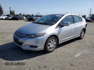 2010 Honda Insight LX with VIN JHMZE2H53AS008294, listed as a Copart auction lot 52011825 with 126,673 mi miles and Salvage Title. Bid and sale history available at DreamBid. Image 1.