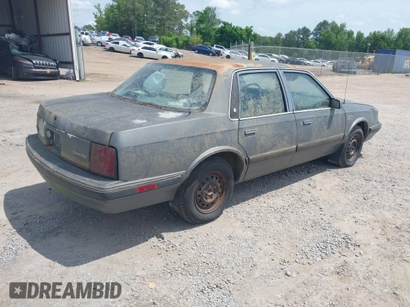 1989 Oldsmobile Cutlass Ciera with VIN 2G3AJ51NXK2439345, listed as a IAAI auction lot 42128301 with 241,434 mi miles and . Bid and sale history available at DreamBid. Image 4.