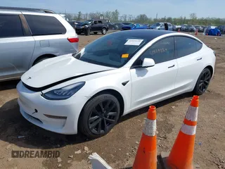 2020 Tesla Model 3 Standard Range Plus with VIN 5YJ3E1EA3LF785951, listed as a IAAI auction lot 41919339 with 63,025 mi miles and . Bid and sale history available at carsss.com. Image 18.