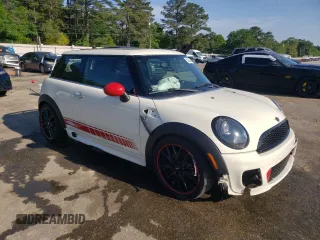 2012 MINI Hardtop with VIN WMWSU3C53CT369974, listed as a Copart auction lot 53238895 with 130,734 mi miles and Salvage Title. Bid and sale history available at DreamBid. Image 4.