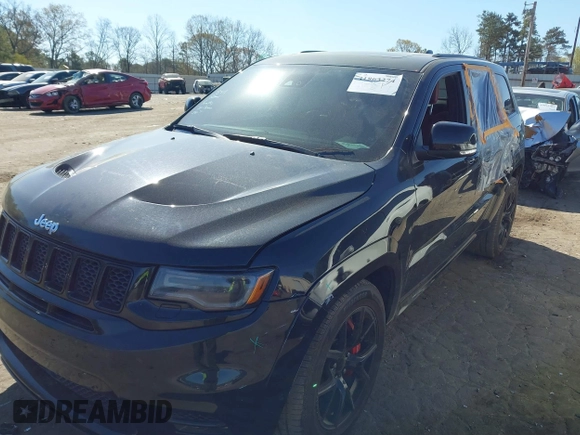 2017 Jeep Grand Cherokee SRT with VIN 1C4RJFDJ2HC696025, listed as a IAAI auction lot 41863274 with 126,949 mi miles. Bid and sale history available at carsss.com. Image 2.