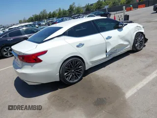 2016 Nissan Maxima SV with VIN 1N4AA6AP6GC903638, listed as a IAAI auction lot 42180421 with 124,586 mi miles and . Bid and sale history available at DreamBid. Image 4.