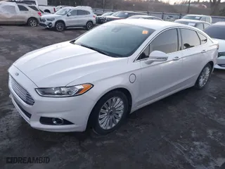 2014 Ford Fusion Energi Titanium with VIN 3FA6P0SU8ER269351, listed as a IAAI auction lot 41145570 with 122,128 mi miles. Bid and sale history available at carsss.com. Image 2.