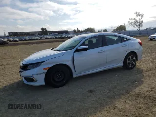 2019 Honda Civic LX with VIN 2HGFC2F69KH597030, listed as a Copart auction lot 43279595 with 67,340 mi miles and Salvage Title. Bid and sale history available at DreamBid. Image 1.