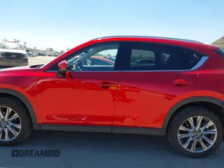 2021 Mazda CX-5 Grand Touring with VIN JM3KFADM5M0470483, listed as a IAAI auction lot 42785031 with 30,749 mi miles and . Bid and sale history available at DreamBid. Image 14.