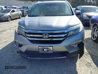 2017 Honda Pilot Touring with VIN 5FNYF6H94HB006873, listed as a IAAI auction lot 41618529 with 154,689 mi miles. Bid and sale history available at carsss.com. Image 12.