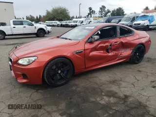 2014 BMW M6 z VIN WBSLX9C52ED160071, wystawiony jako Copart lot #77452554 z przebiegiem 64 814 mil mil oraz Szkody całkowita. Historia ofert i sprzedaży dostępna na DreamBid. Obrazek 1.