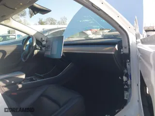 2018 Tesla Model 3 Long Range Battery with VIN 5YJ3E1EA6JF042844, listed as a IAAI auction lot 41349172 with 122,851 mi miles. Bid and sale history available at carsss.com. Image 5.