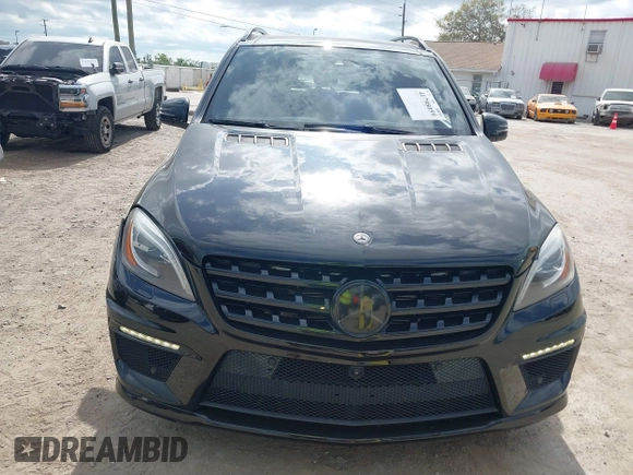 2014 Mercedes-Benz M 63 AMG z VIN 4JGDA7EB5EA320042, wystawiony jako IAAI lot #41798059 z przebiegiem 111 866 mil mil oraz . Historia ofert i sprzedaży dostępna na DreamBid. Obrazek 13.