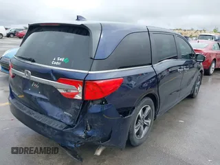2018 Honda Odyssey Touring with VIN 5FNRL6H85JB001501, listed as a IAAI auction lot 41911497 with 92,407 mi miles. Bid and sale history available at carsss.com. Image 4.
