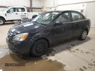 2010 Kia Rio with VIN KNADH4B37A6641845, listed as a Copart auction lot 51861215 with 163,894 mi miles and Salvage Title. Bid and sale history available at DreamBid. Image 1.