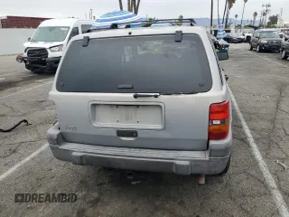1997 Jeep Grand Cherokee Laredo with VIN 1J4GZ58S0VC771727, listed as a Copart auction lot 82233224 with 320,213 mi miles and Salvage Title. Bid and sale history available at carsss.com. Image 6.