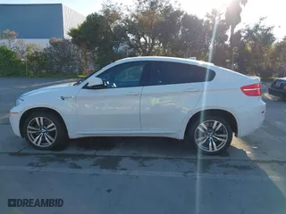 2012 BMW X6 M with VIN 5YMGZ0C59CLK14913, listed as a IAAI auction lot 41635362 with 137,979 mi miles. Bid and sale history available at carsss.com. Image 14.